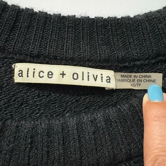 Alice + Olivia Black Jolynn Shoulder SlitRaglan Sleeve with Pearly Buttons.